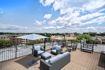 A patio with a table and chairs overlooking a cityscape at Park Terrace, Washington